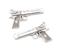 Two silver-tone 34 x 20mm pistol charms with textured grips on a white background