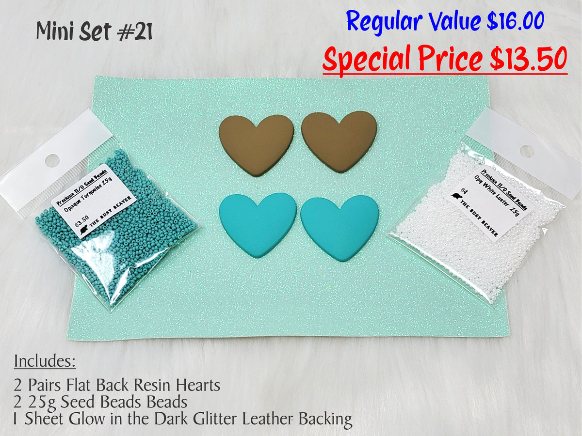 Mini set #21: brown and teal resin hearts, teal and white seed beads, and a mint glitter backing sheet