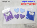 Mini set #22: light blue and purple resin hearts, purple and blue seed beads, and a white beading foundation