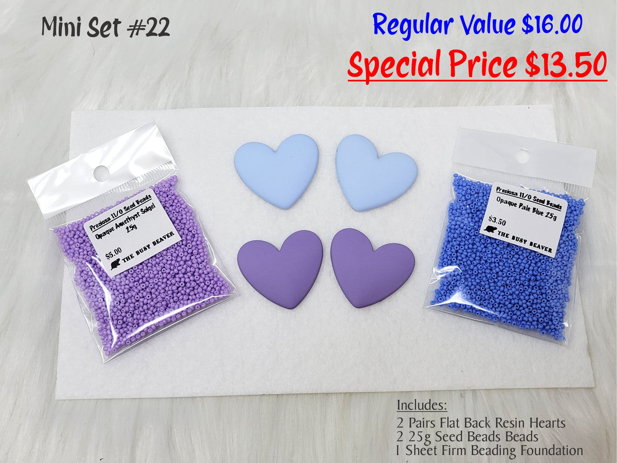 Mini set #22: light blue and purple resin hearts, purple and blue seed beads, and a white beading foundation