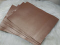 Stack of #23 rose gold faux leather sheets with a metallic sheen