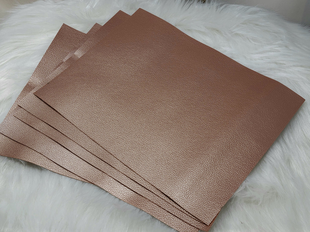 Stack of #23 rose gold faux leather sheets with a metallic sheen
