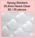 Sheet of 25.4mm heart clear epoxy dome stickers with a pink label
