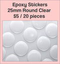 Sheet of 25mm round clear epoxy dome stickers with a pink label