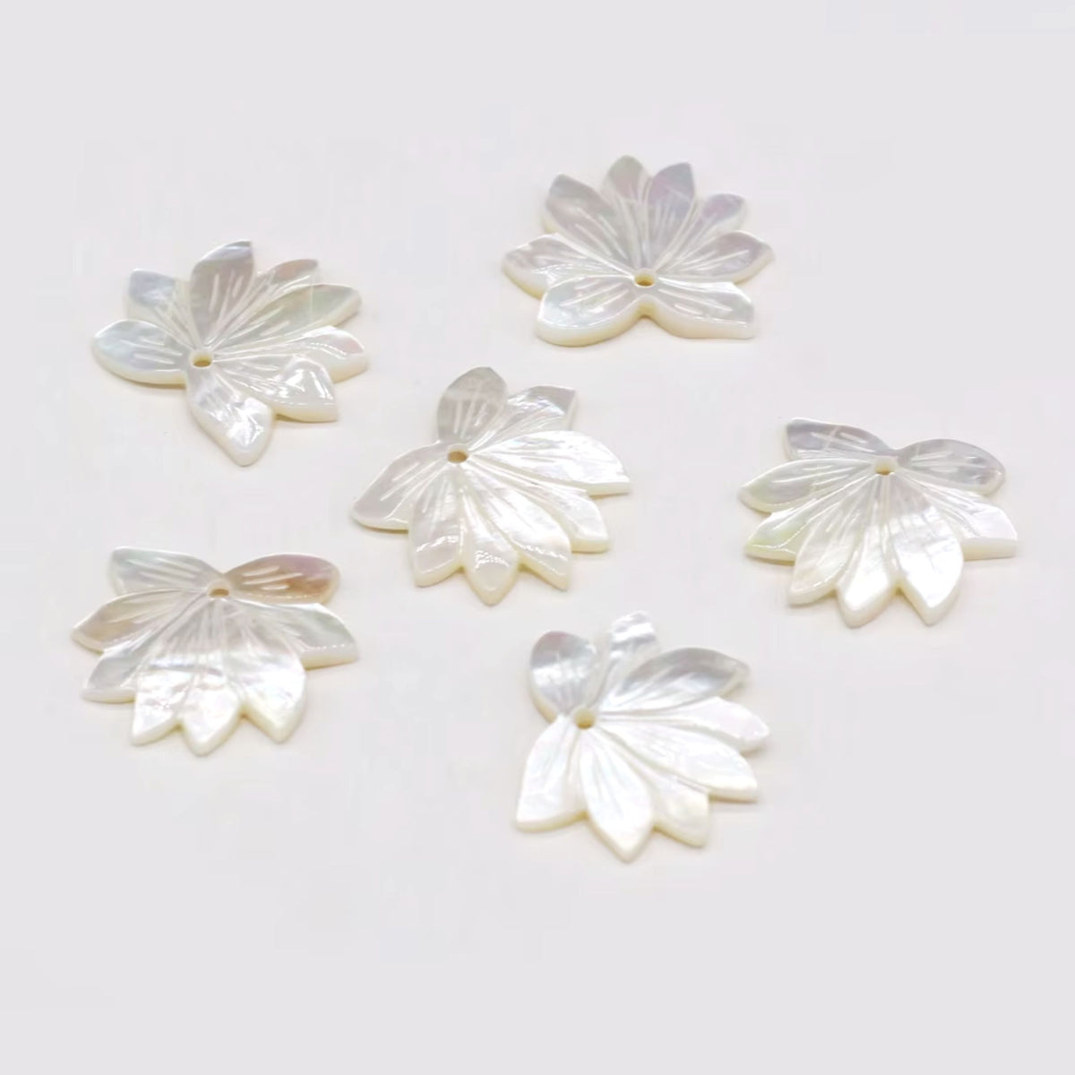 Carved mother of pearl flower pendants, 27mm, in white with layered petals