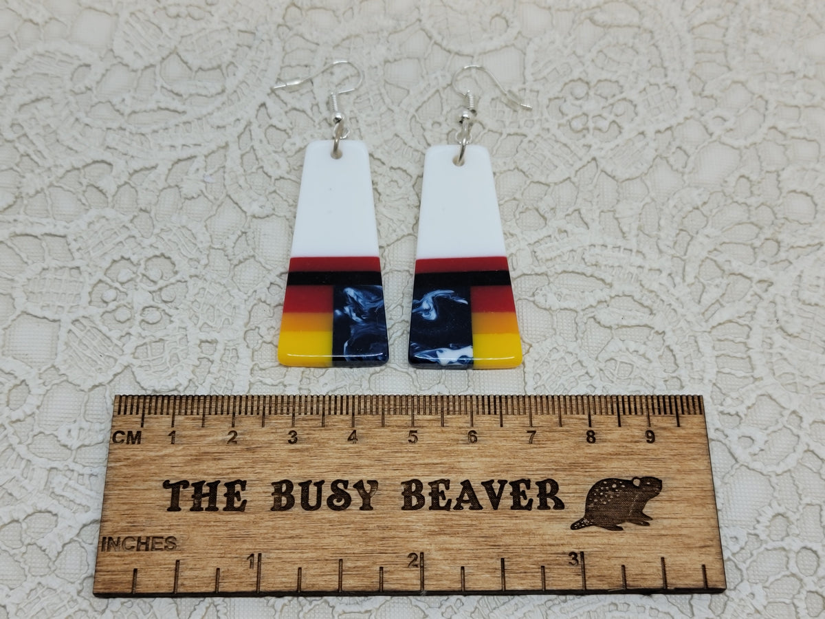 Pair of tapered resin slab inlay earrings, combo #29: white with sunset stripes and navy marble