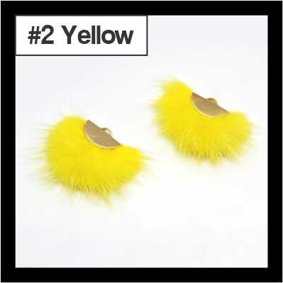 Pair of fan-shaped yellow faux mink tassels with gold-tone caps, labelled #2
