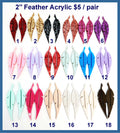 Eighteen pairs of 2 inch acrylic feather cabochons (cabs) in glitter, solid and marbled colours