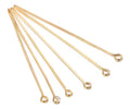 Fan of 30mm KC gold 20 gauge eye pins, each with a small round loop at one end, on white