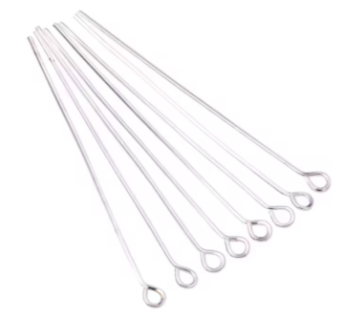 Fan of 30mm silver 20 gauge eye pins, each with a small round loop at one end, on white