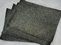 Stack of #33 black gold glitter faux leather sheets with a sparkly textured surface