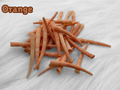 Pile of orange dyed smooth dentalium shells, about 1.5 to 2 inches long, on white faux fur