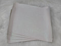 Stack of #34 white glitter faux leather sheets with a sparkly textured surface