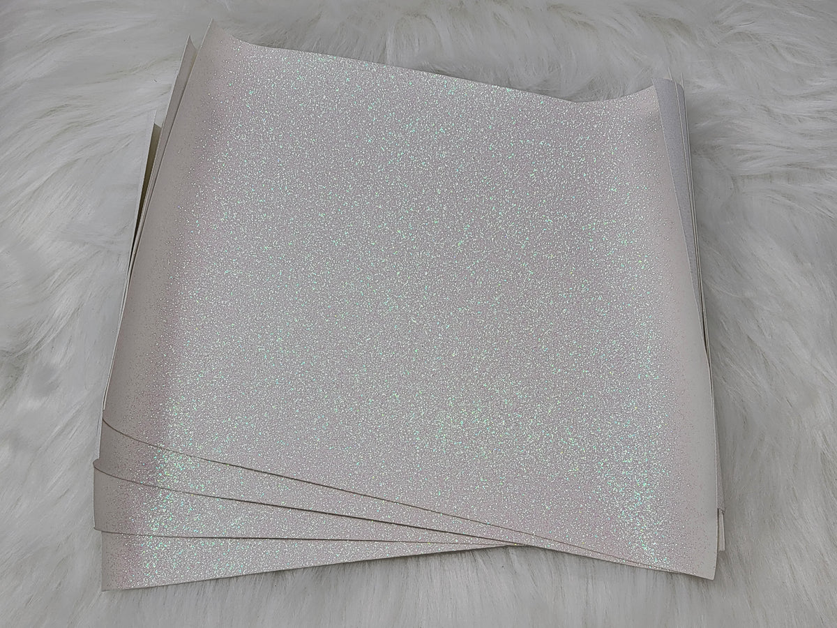 Stack of #34 white glitter faux leather sheets with a sparkly textured surface