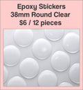 Sheet of 38mm round clear epoxy dome stickers with a pink label