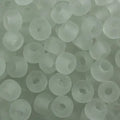 Close-up of 9mm glass crow beads in matte transparent clear, filling the frame