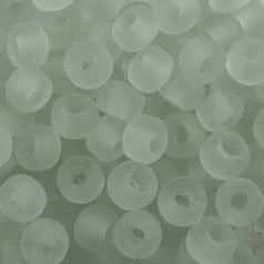 Close-up of 9mm glass crow beads in matte transparent clear, filling the frame