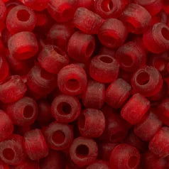 Close-up of 9mm glass crow beads in matte transparent red, filling the frame