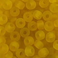 Close-up of 9mm glass crow beads in matte transparent yellow