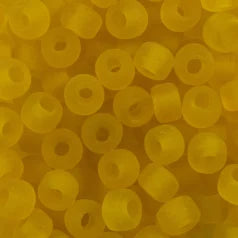 Close-up of 9mm glass crow beads in matte transparent yellow