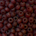 Close-up of 9mm glass crow beads in matte transparent dark red