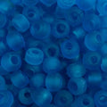 Close-up of 9mm glass crow beads in matte transparent blue, filling the frame