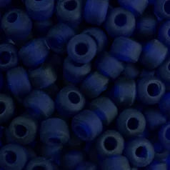 Close-up of 9mm glass crow beads in matte transparent cobalt blue