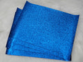 Stack of #41 blue glitter faux leather sheets with a sparkly textured surface
