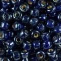 Close-up of 9mm glass crow beads in cobalt blue with a lustre finish