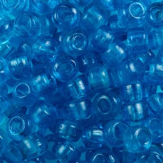 Close-up of 9mm glass crow beads in transparent aqua, filling the frame