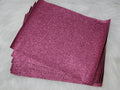 Stack of #43 pink glitter faux leather sheets with a sparkly textured surface