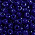 Close-up of 9mm glass crow beads in opaque sapphire, filling the frame