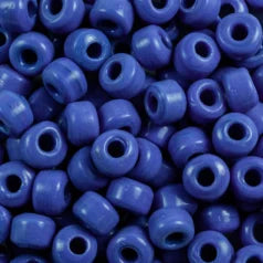 Close-up of 9mm glass crow beads in opaque light blue, filling the frame