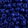 Close-up of 9mm glass crow beads in opaque blue, filling the frame