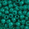 Close-up of 9mm glass crow beads in opaque turquoise green, filling the frame