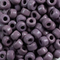 Close-up of 9mm glass crow beads in opaque taupe, filling the frame