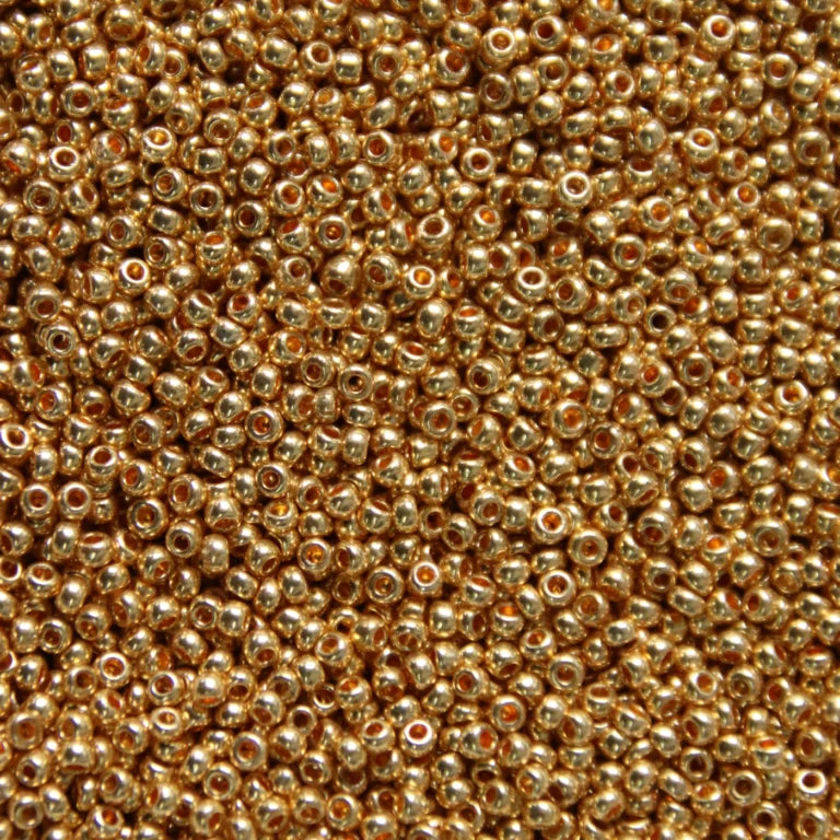 Close-up of Preciosa 11/0 Czech glass seed beads in metallic light gold