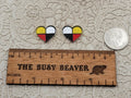 Pair of Four Directions heart cabochons (cabs) in black, white, red and yellow beside a coin and ruler