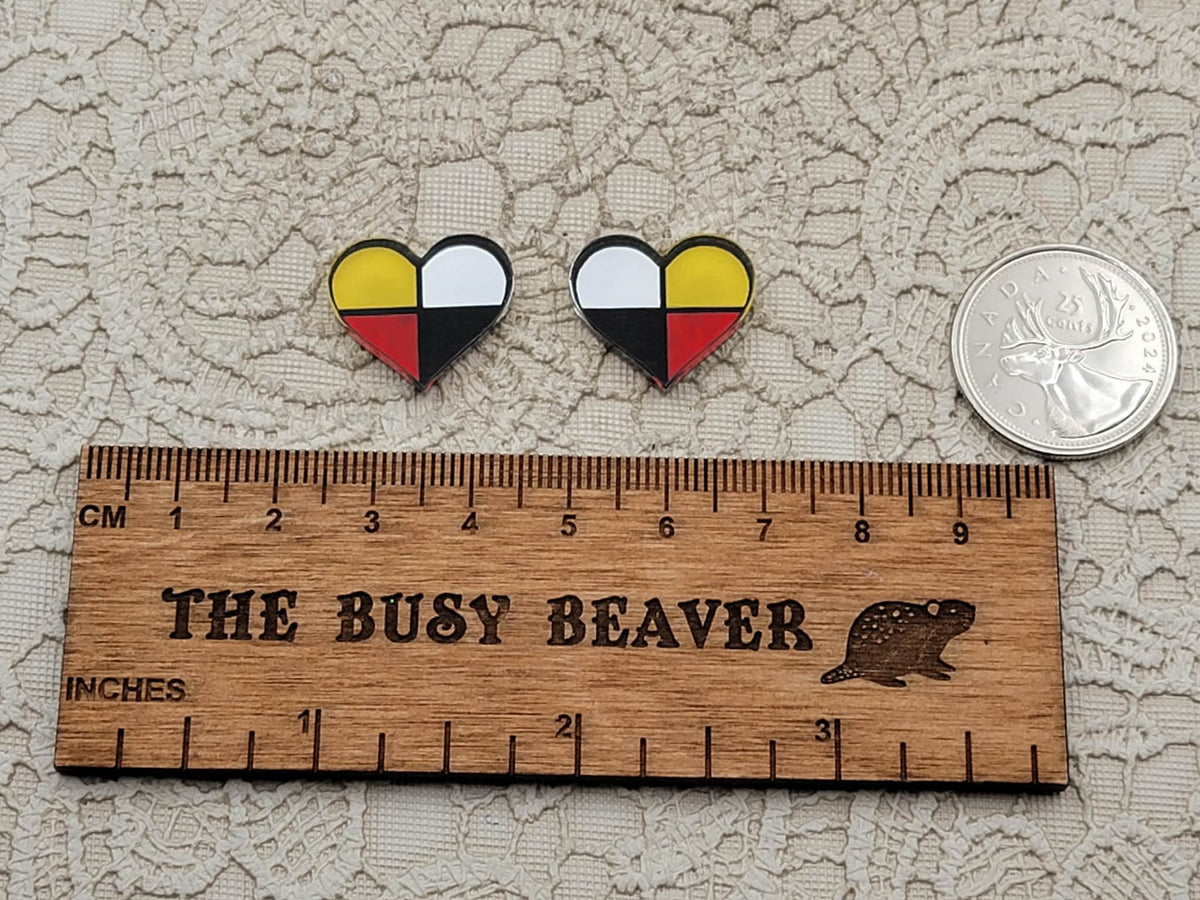 Pair of Four Directions heart cabochons (cabs) in black, white, red and yellow beside a coin and ruler