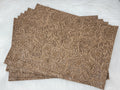 Stack of #54 sand faux leather sheets embossed with a tooled floral scroll pattern
