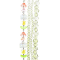 Four strands of Crystal Lane glass beads with flower, leaf and faceted round beads in a yellow ombre mix