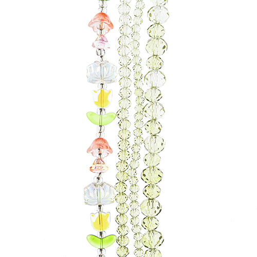 Four strands of Crystal Lane glass beads with flower, leaf and faceted round beads in a yellow ombre mix