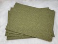 Stack of #60 sage faux leather sheets embossed with a tooled floral scroll pattern