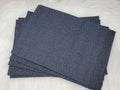 Stack of #61 denim faux leather sheets embossed with a tooled floral scroll pattern