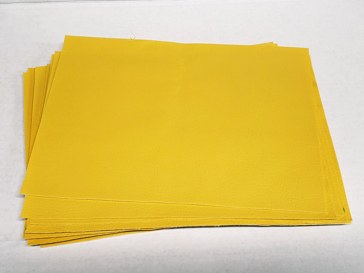 Stack of #6 yellow faux leather sheets with a pebbled grain texture