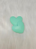 Pair of 37mm matte resin heart cabochons (cabs) in #6 Mint on white faux fur