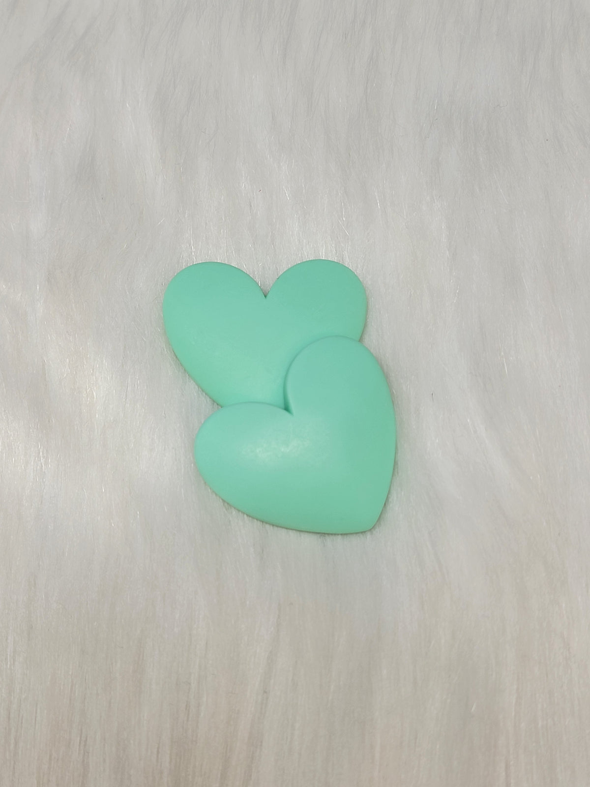 Pair of 37mm matte resin heart cabochons (cabs) in #6 Mint on white faux fur