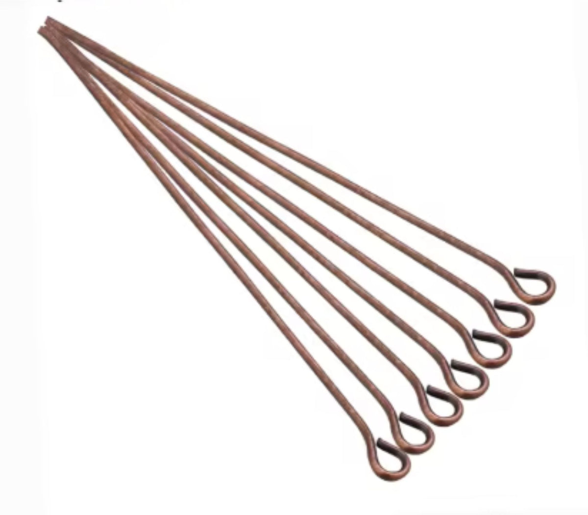 Fan of 70mm copper 20 gauge eye pins, each with a small round loop at one end, on white