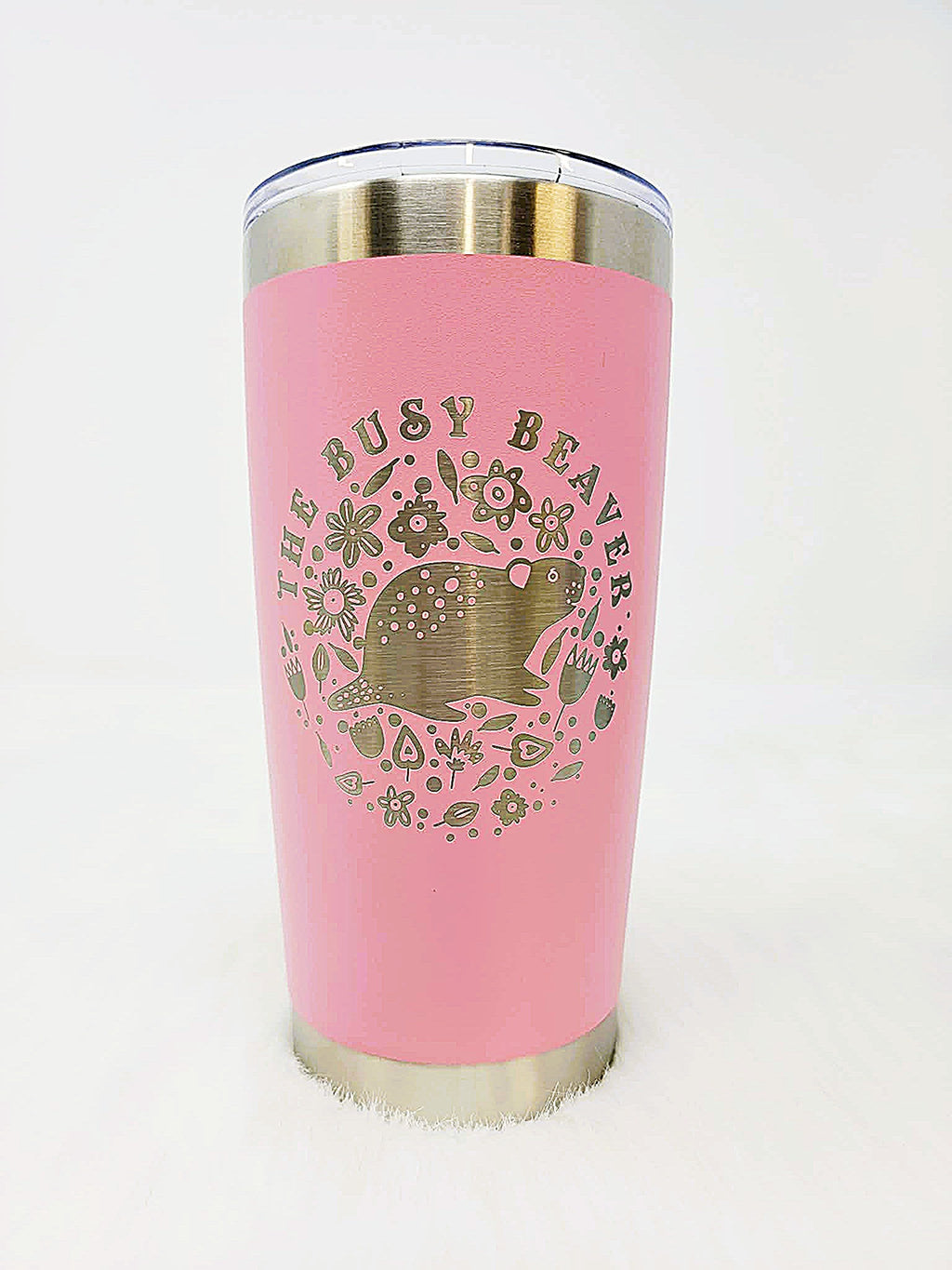 Pink stainless steel tumbler engraved with a round floral beaver logo