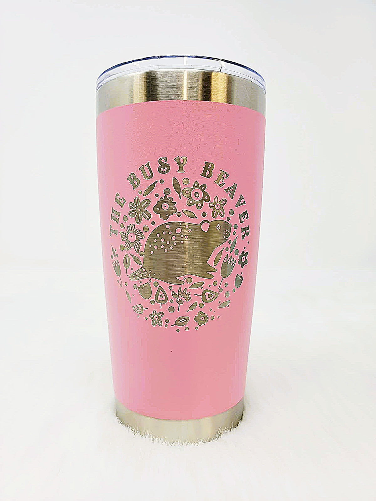 Pink stainless steel tumbler engraved with a round floral beaver logo
